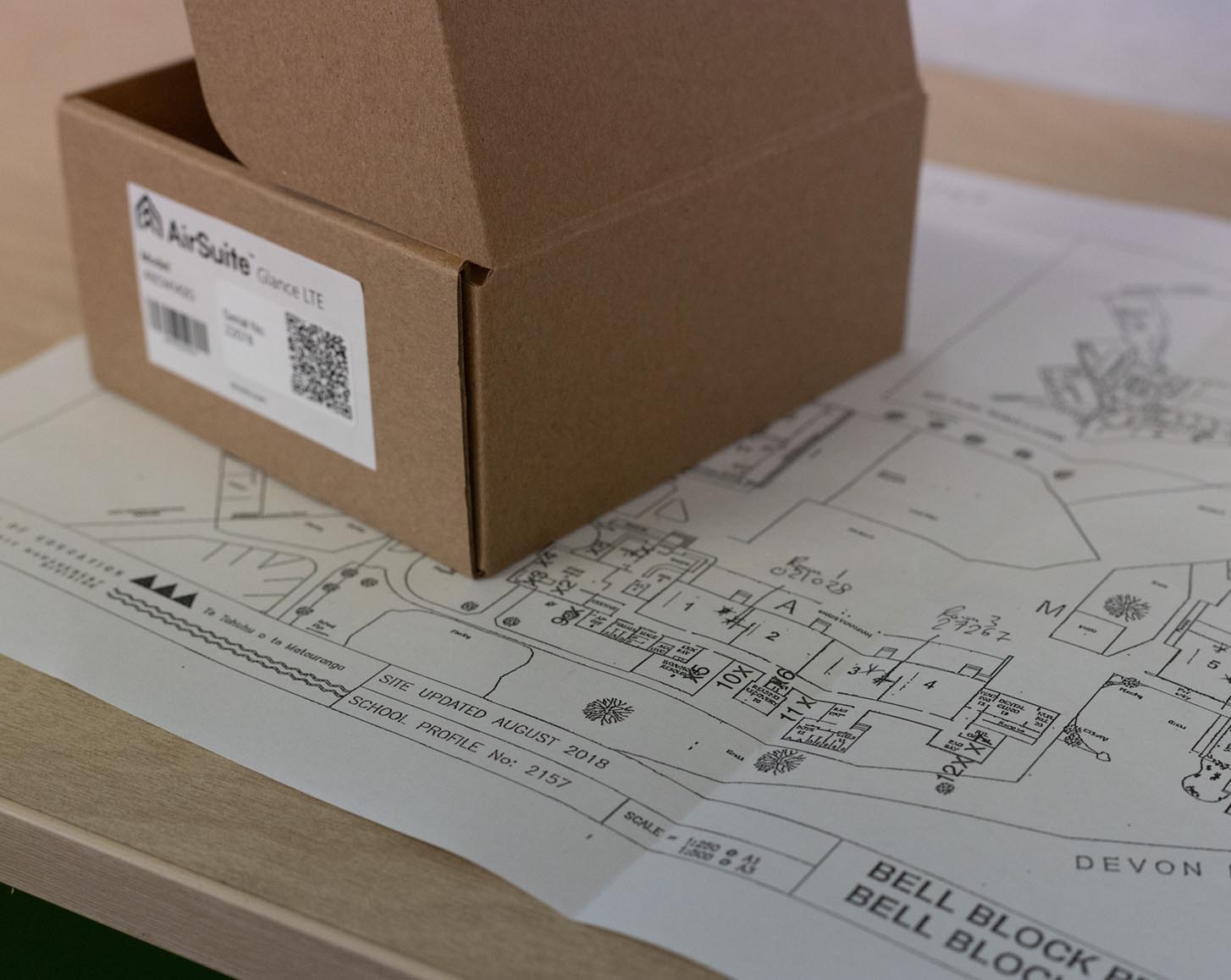 An AirSuite Glance box on top of a school site plan